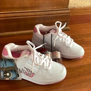Brand new kids heelys with pink flame on the side!